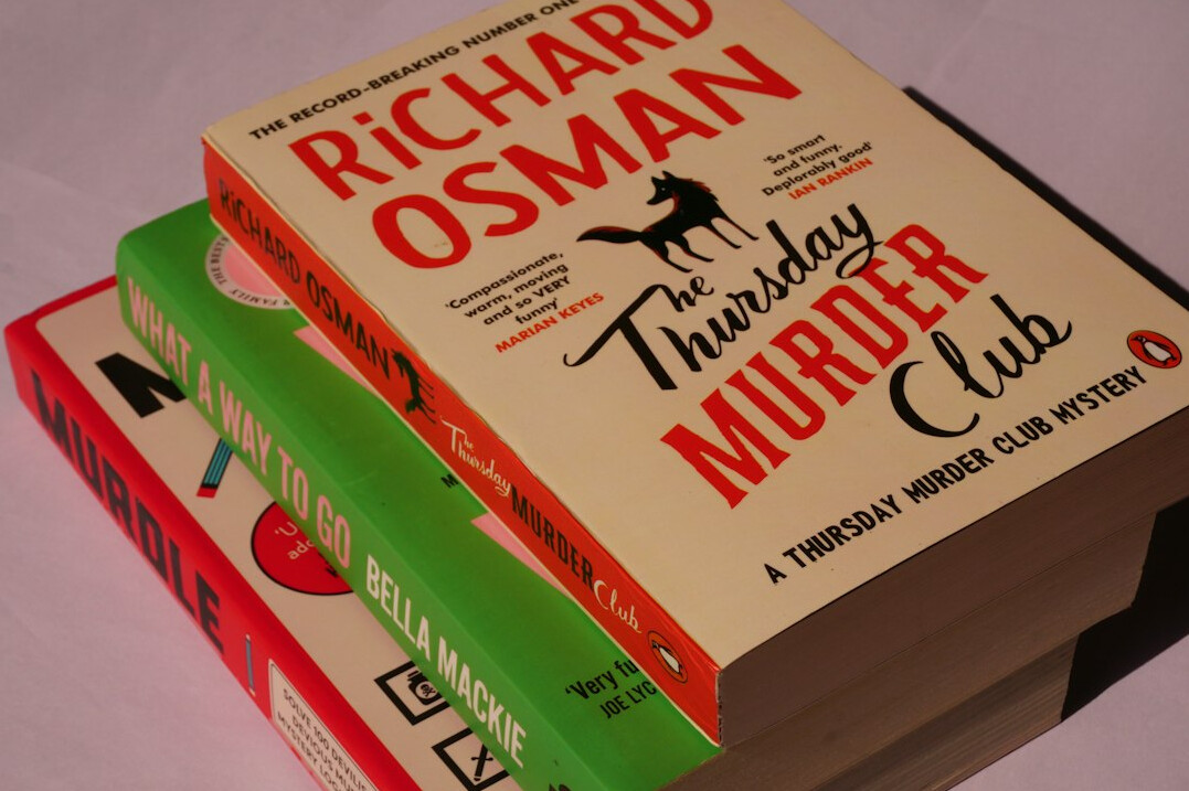 Stack of detective novels and paperback books