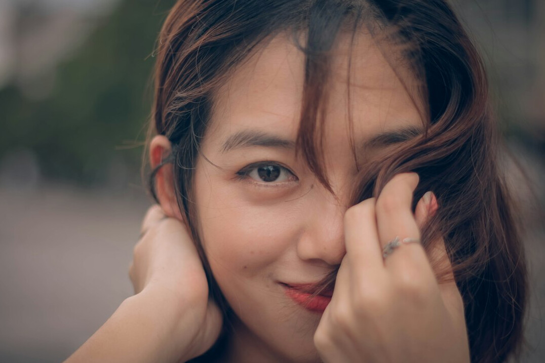 Portrait of a smiling young woman with brown hair
