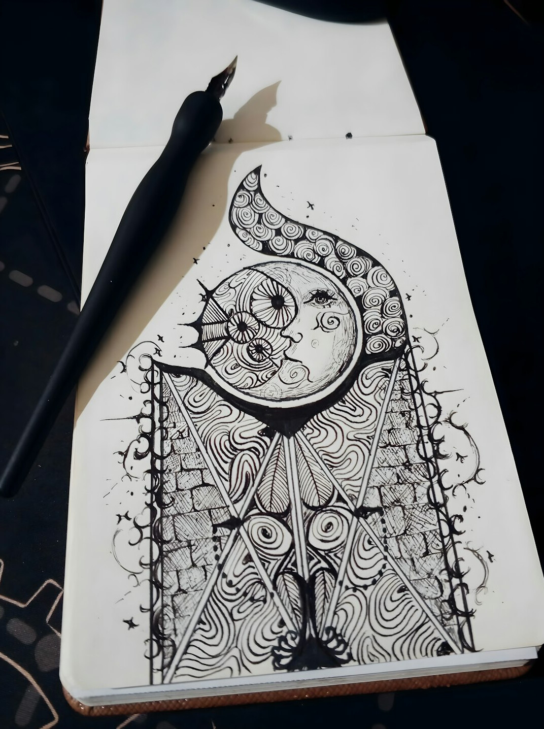 Notebook and pen on a wooden desk, writing a mystery story