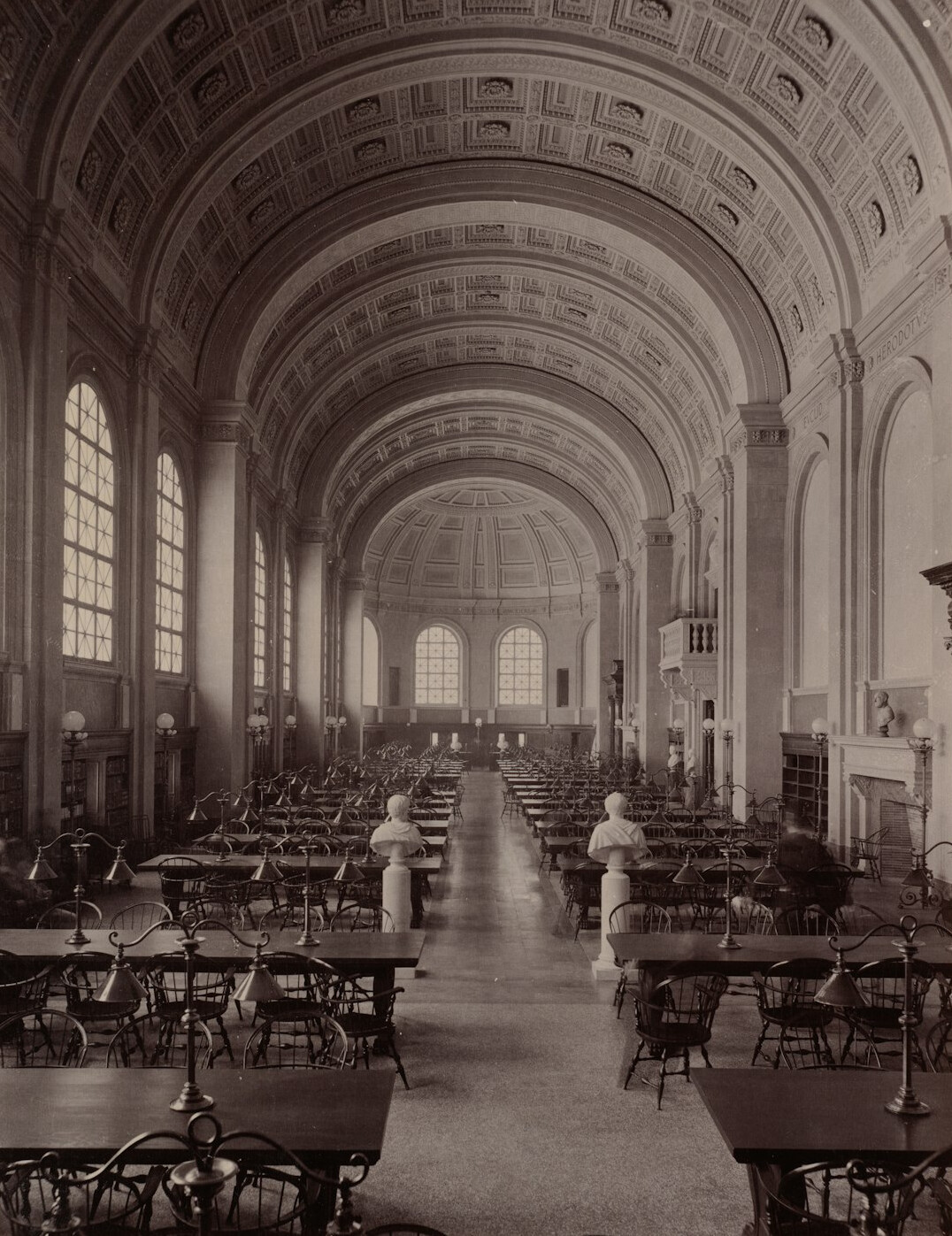 Quiet library reading hall with wooden tables and bookshelves